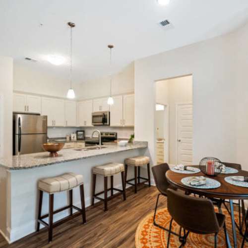 Modern kitchen with dining area at Lodge at Lake Wylie in Lake Wylie, South Carolina