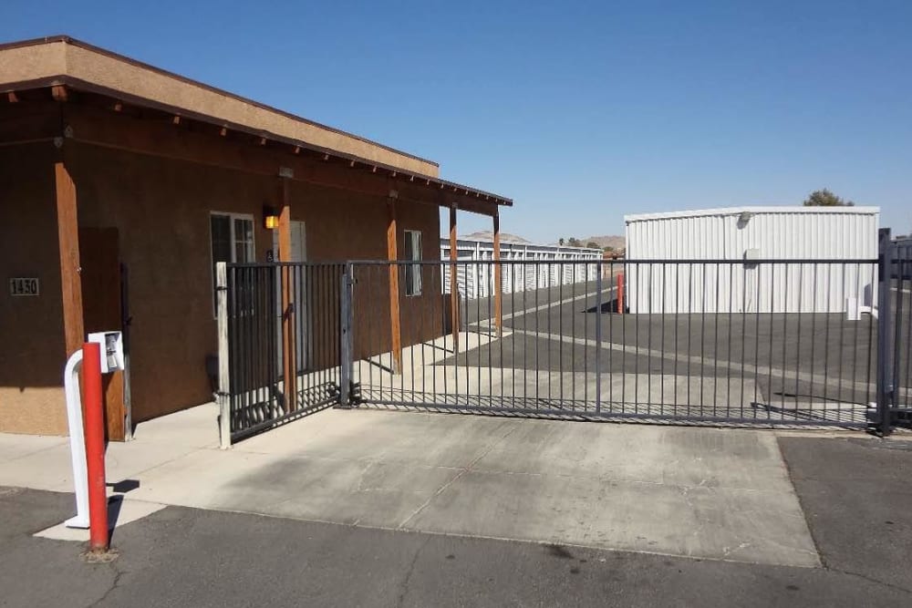 Main entrance of A-American Self Storage in Ridgecrest, California with electronic gate access