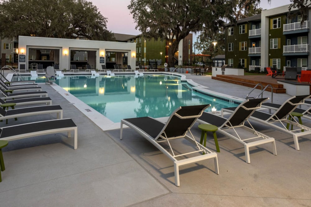 recreation outdoor pool surrounded by lounge chairs at Mariner Grove in Savannah, Georgia
