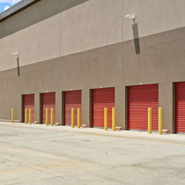 Outdoor storage units with red doors at StorQuest Self Storage in La Quinta, California