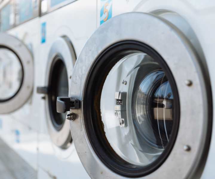 Laundry center with adjacent play/work lounge at Camas Meadows in Beaverton, Oregon