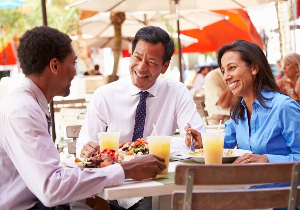 Resident chatting with coworkers during lunch near Terra at Portola Park in Livermore, California