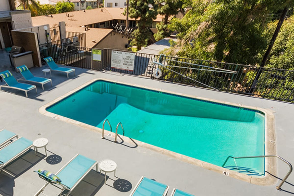 Beautiful pool with lounge chairs at Amanda Regency Apartments, Van Nuys, California
