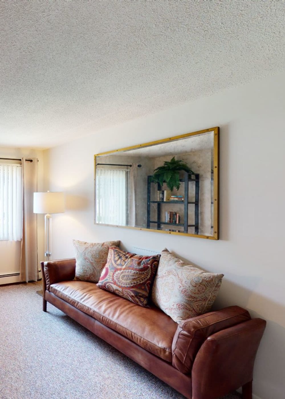 Office room with leather couch at Tanglewood Apartments & Townhomes in Erie, Pennsylvania