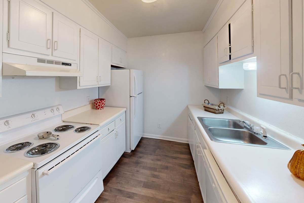 White kitchen with dishwasher at Sedgefield in Florence, South Carolina