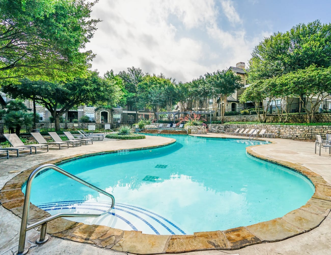 Resident clubhouse and pool with ample seating and more at Beck at Wells Branch in Austin, Texas
