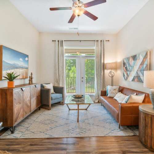Vibrant living room with ceiling fan at Lodge at Lake Wylie in Lake Wylie, South Carolina