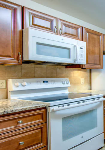 Hardwood cabinets in kitchen at Lime Tree Village in Deerfield Beach, Florida