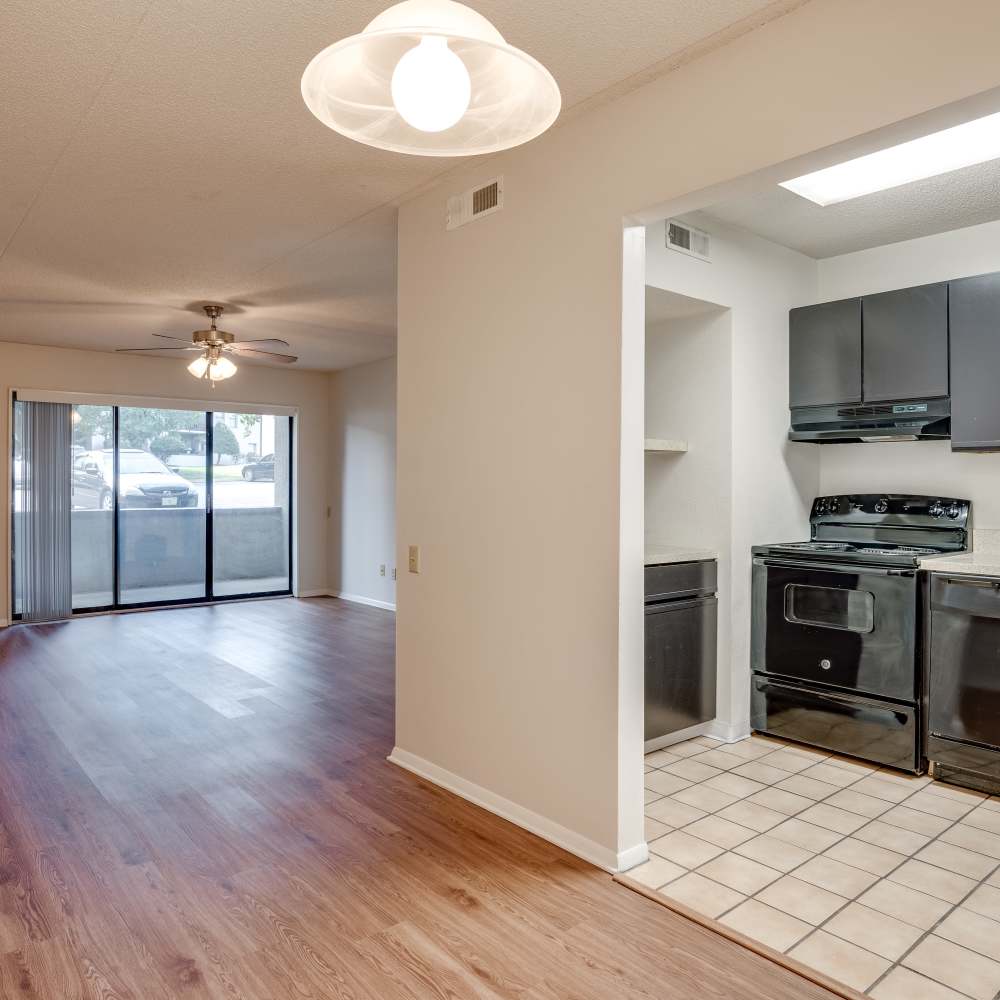 Living room with kitchen access at Germantown Gardens in East Ridge, Tennessee