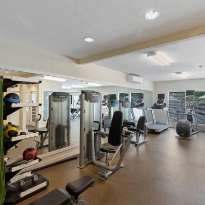 Onsite fitness center with various workout equipment and cardio machines at Skyline Redmond in Redmond, Washington