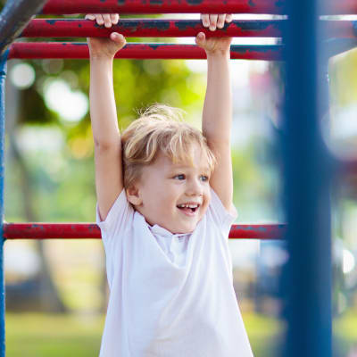 Smiling child playing on playground at Mountain View in Fallon, Nevada