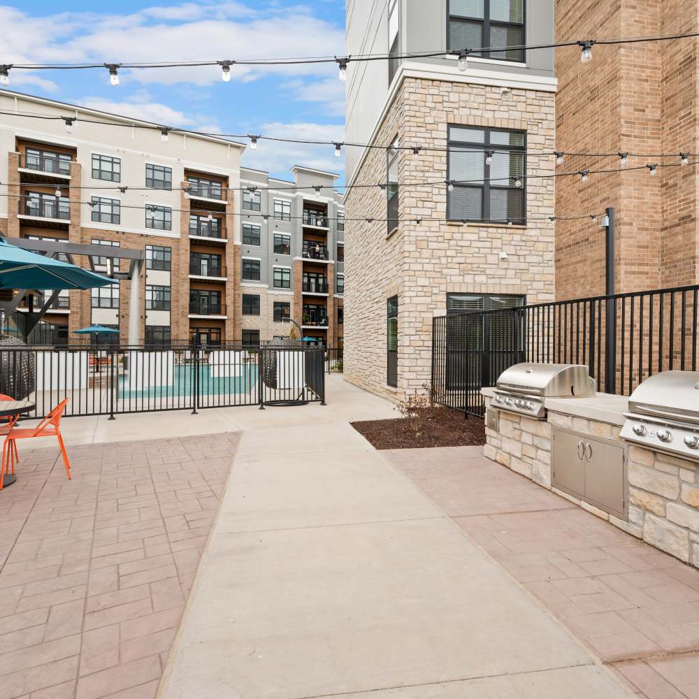 Grill stating with community view at Neo Vantage Point in Maryland Heights, Missouri