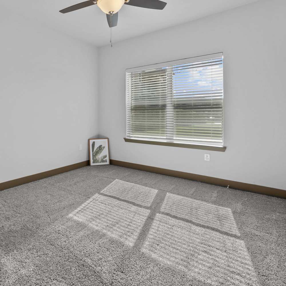 Bedroom with a window at Harvest Creek in Marshall, Texas
