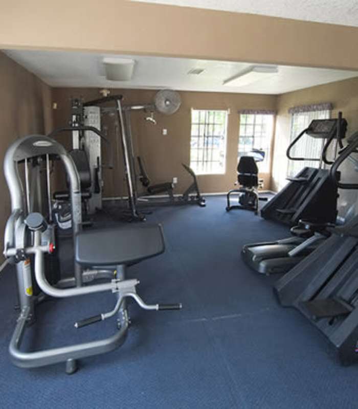 Resident working out in the gym at The Willows in Escondido, California