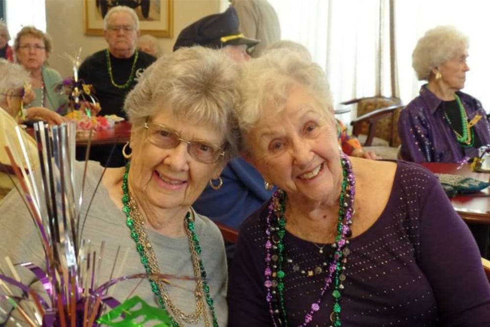 Happy friends posing for a photo at Roseville Commons Senior Living in Roseville, California