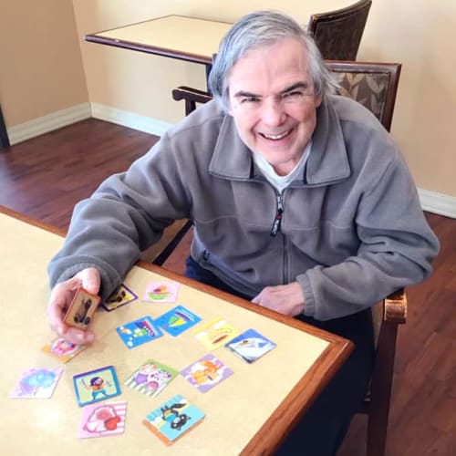 A Resident playing a matching game at Oxford Glen Memory Care at Grand Prairie in Grand Prairie, Texas