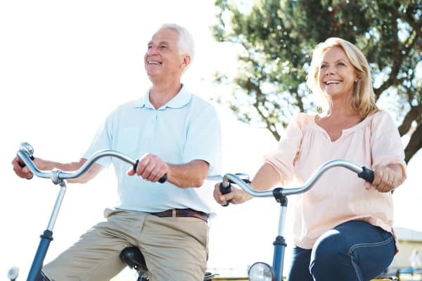 Senior couple bike riding at Clearwater at Riverpark in Oxnard, California