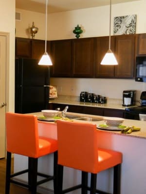 Fully equipped gourmet kitchen with pendant lighting at The BLVD in San Angelo, Texas