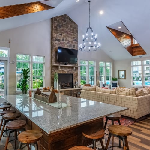 Resident clubhouse with long table for work or dining at Glenmoor Oaks in Moseley, Virginia