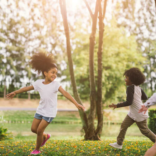 Children having fun at park near The Village at NTC in San Diego, California