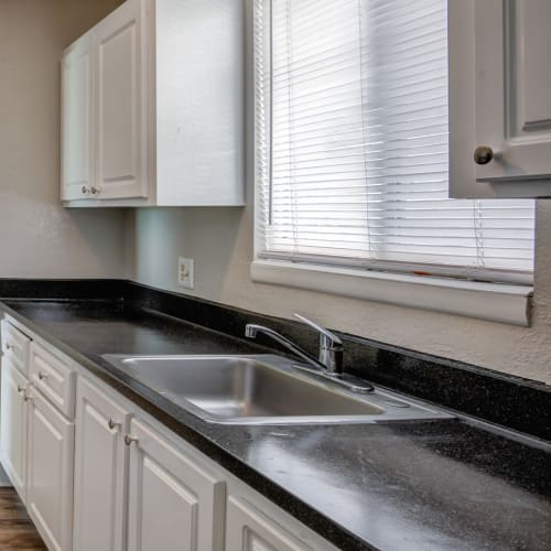 Apartment kitchen with a window over the sink at Costa Del Lago in Lake Worth, Florida