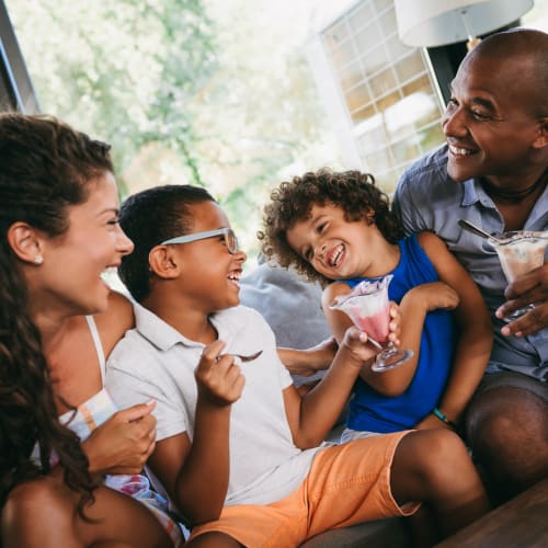 A happy family eating ice cream near Lyman Park in Quantico, Virginia