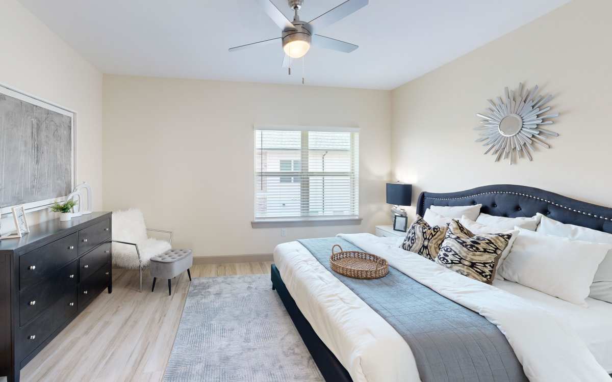 Bedroom with large window at Malloy Bridge in Seagoville, Texas