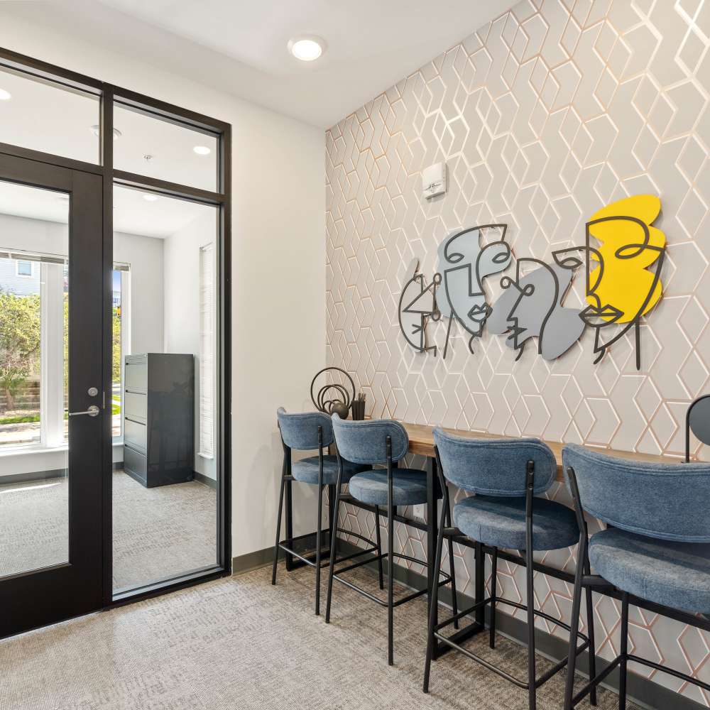 Community building with signage at The Flats At 402 in Madison, Wisconsin