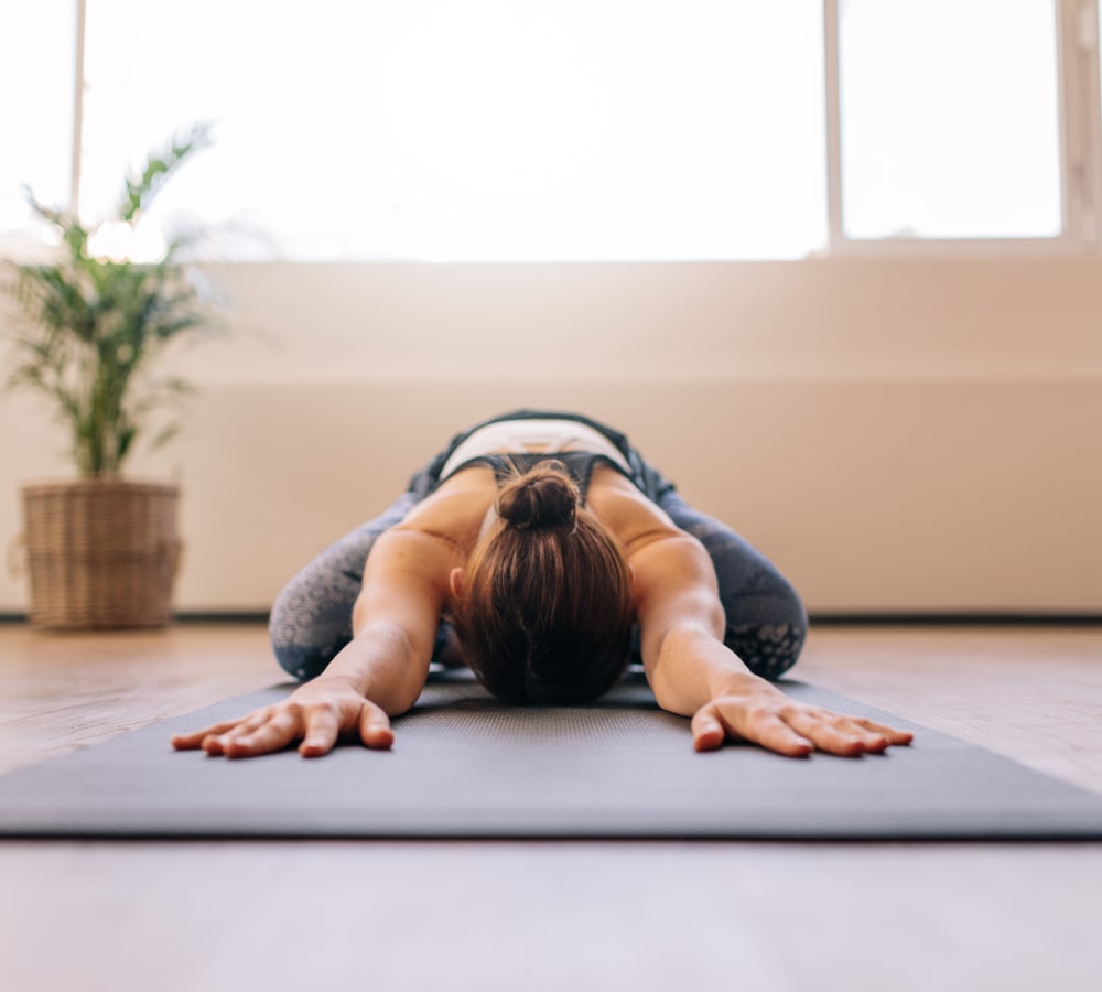 Resident finishing a yoga sequence at Terra at Portola Park in Livermore, California