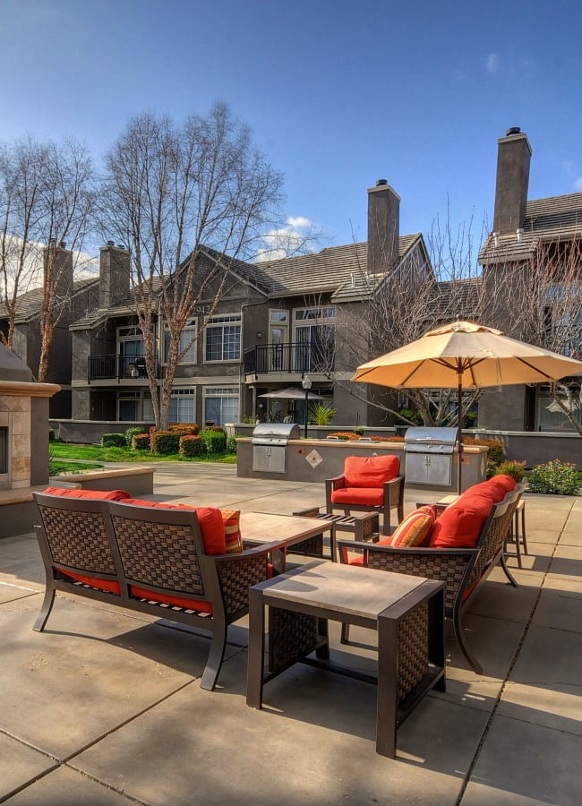 A resident patio with outdoor BBQ grills at Larkspur Woods in Sacramento, California