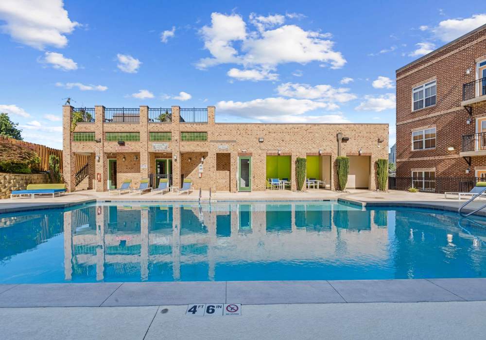 Resident swimming in pool at CityView Apartments in Greensboro, North Carolina