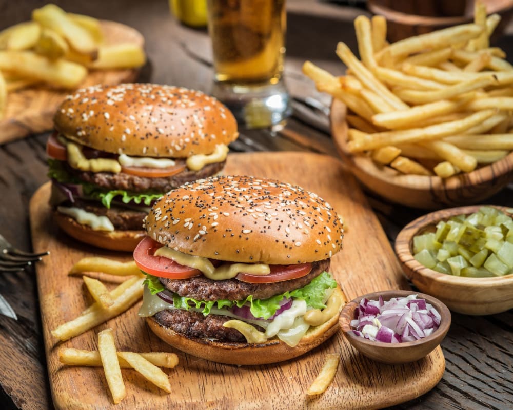 Residents enjoying a burger and fries near Haven at Golf Creek in Portland, Oregon