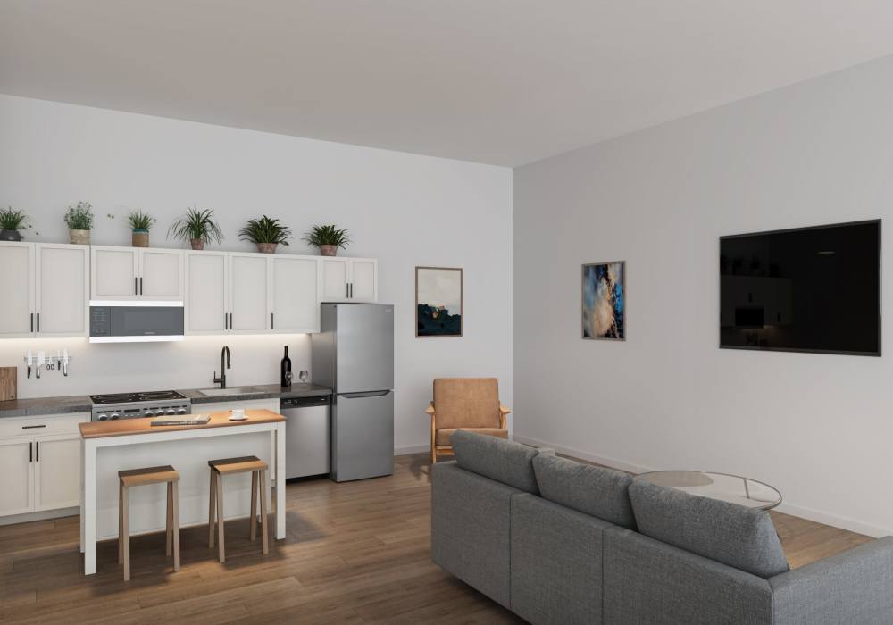 Cozy living room with connecting kitchen and dining area at Woodland Flats in Gresham, Oregon