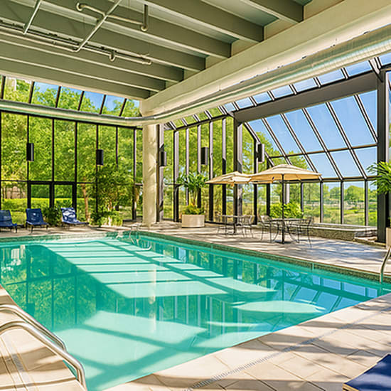 Indoor pool with lounge chairs at Riverfront Towers in Detroit, Michigan