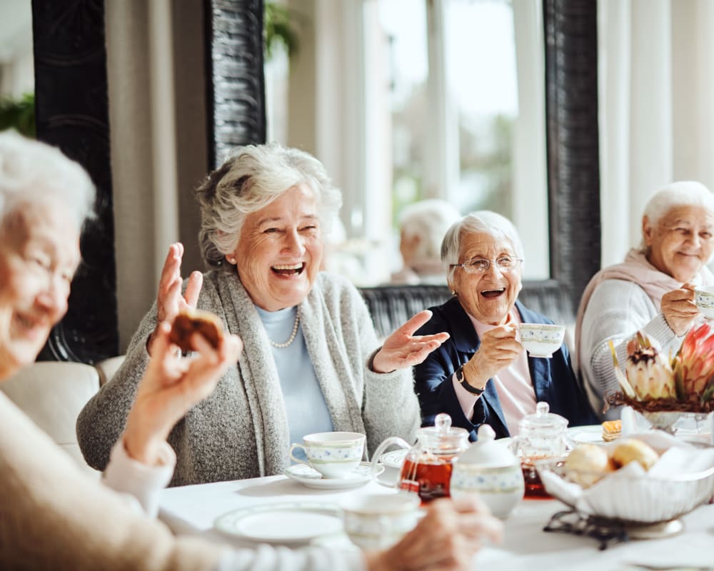 Residents enjoying tea in dining room at Carolina Assisted Living in Appleton, Wisconsin.