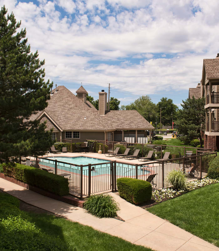 Exterior and pool at Crown Chase Apartments in Wichita, Kansas