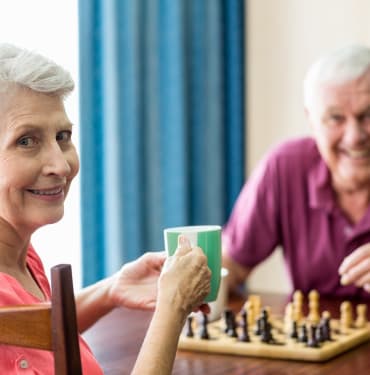 Residents playing chess at The Renaissance at Coeur d'Alene in Coeur d'Alene, ID