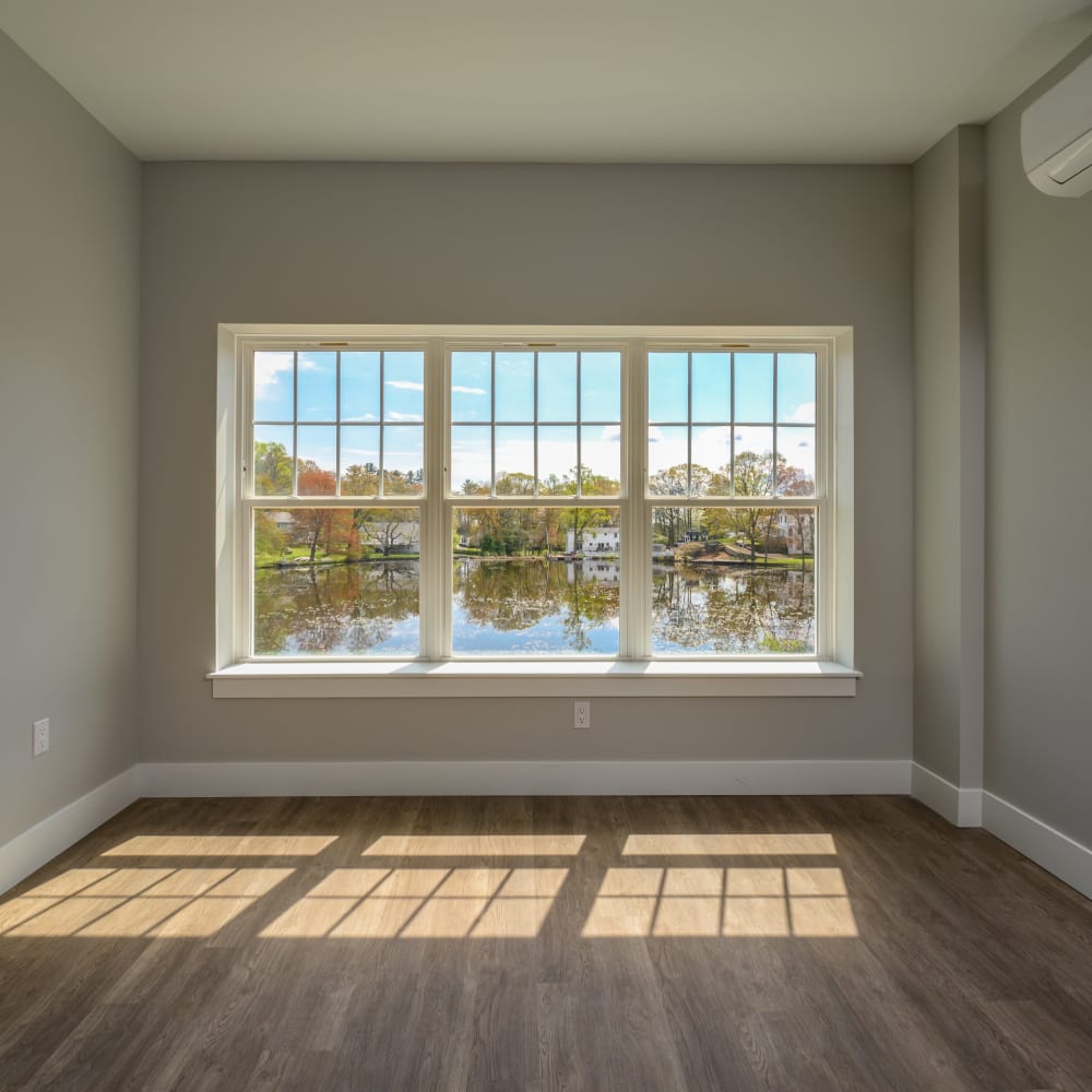 Room with hardwood floors and a window providing natural light at Lakeside of Cheshire in Cheshire, Connecticut