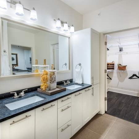 Bathroom with tiled walk-in shower at The Reverie at Lake Boone in Raleigh, North Carolina