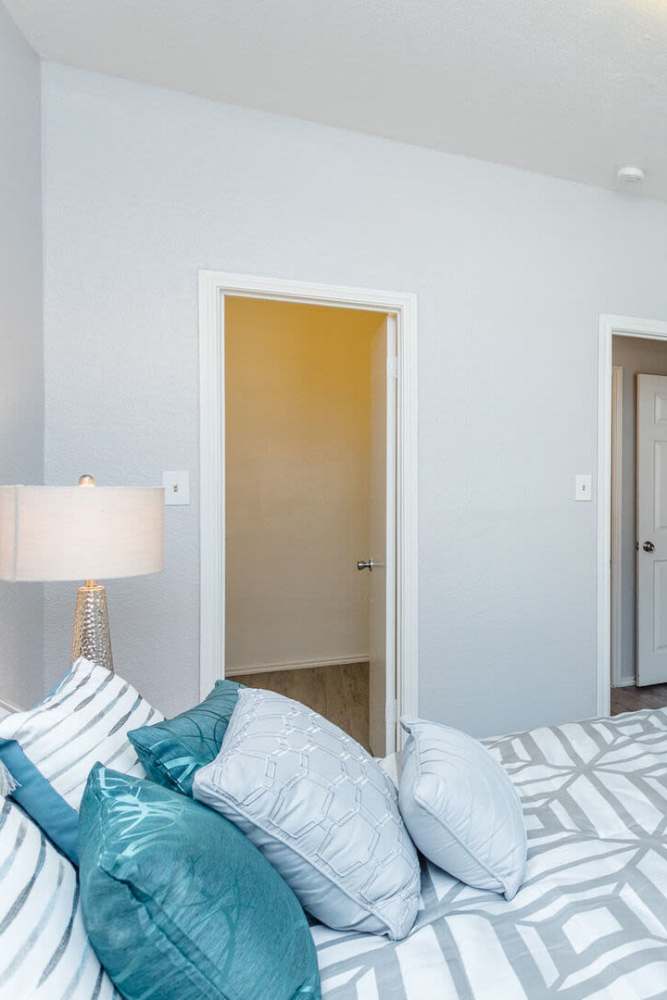 Bedroom with attached closet at Green Tree Place in Houston, Texas