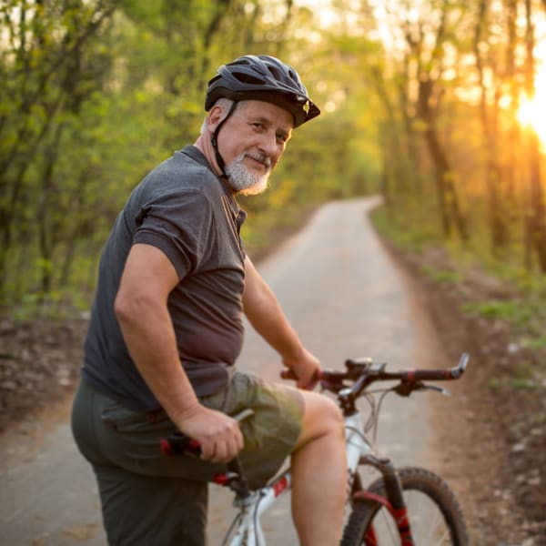 A man biking on a trail near The Atrium at Carmichael in Carmichael, California
