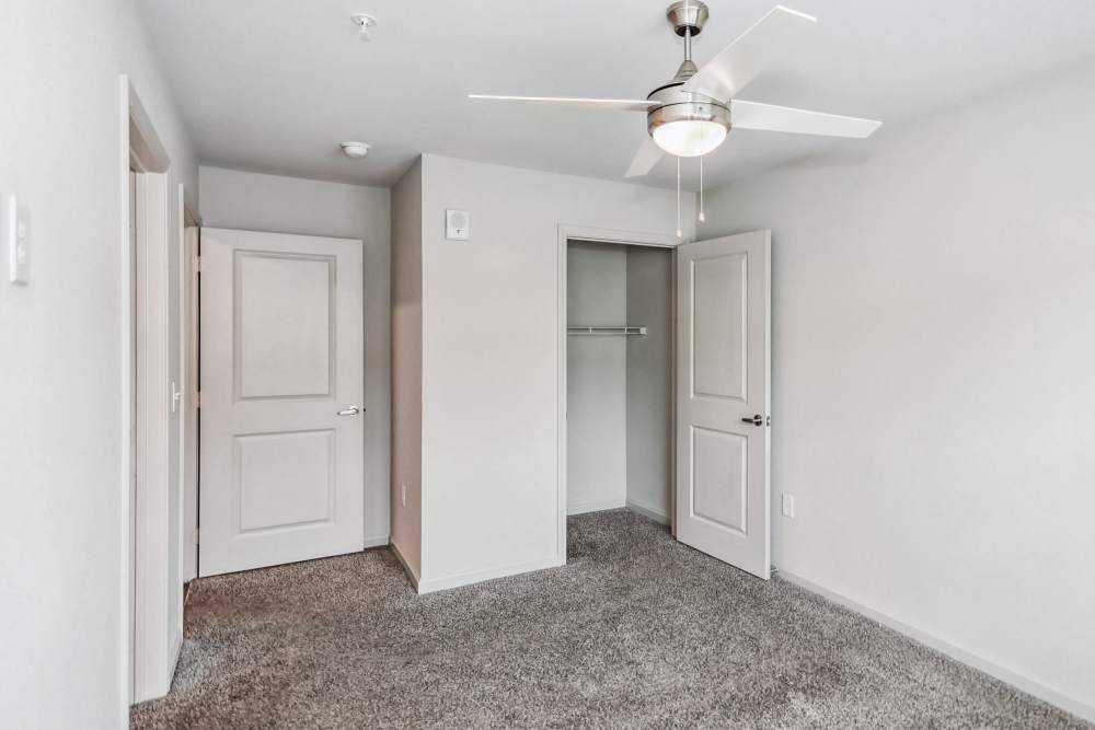 Bedroom with easy access to the walk-in closet at Flats at Mount Zion in Stockbridge, Georgia