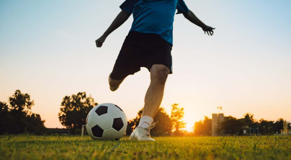 Guy playing soccer near San Juan Del Centro in Boulder, Colorado