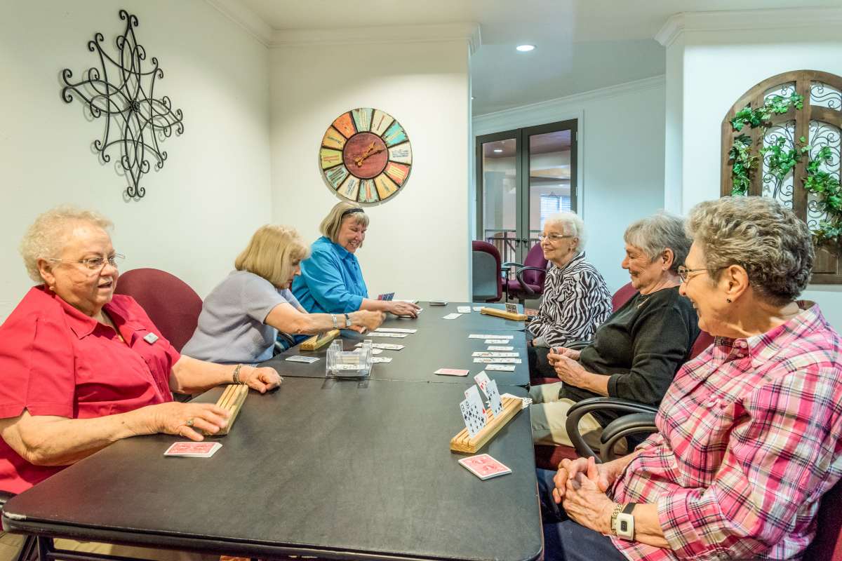 Residents playing card games at Isle at Watercrest Mansfield in Mansfield, Texas