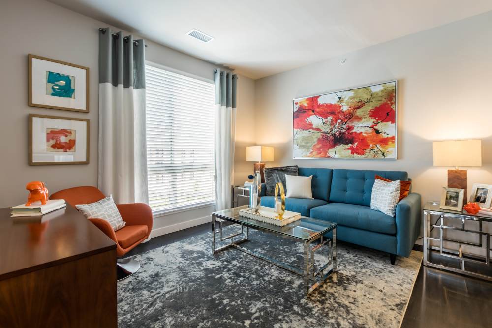 Living room and kitchen with island at Strata Apartments in Denver, Colorado