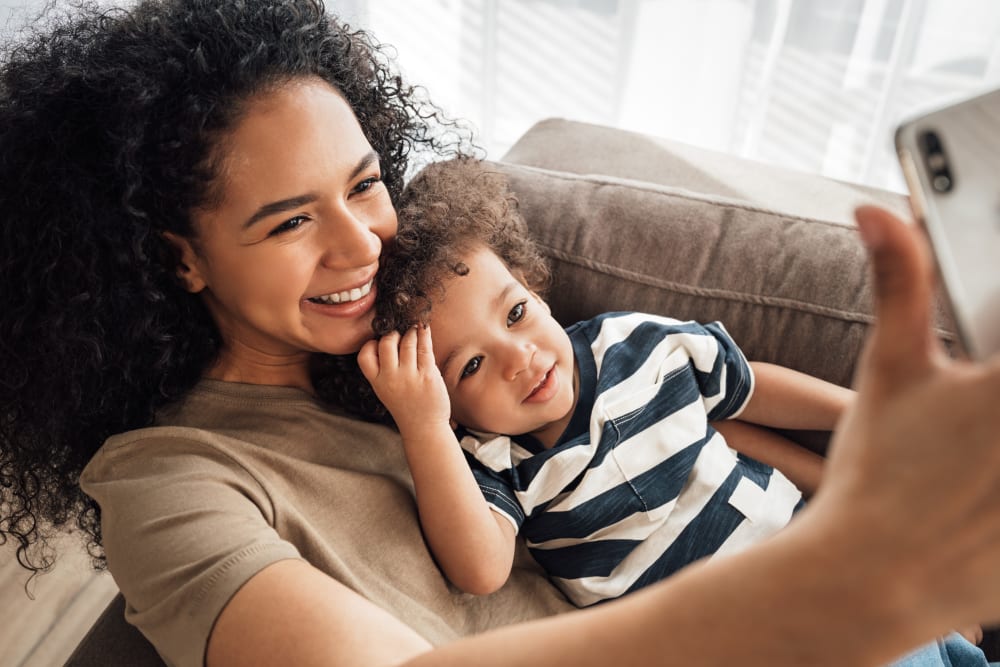 Resident and child enjoying time together at Avenue 25 in Phoenix, Arizona