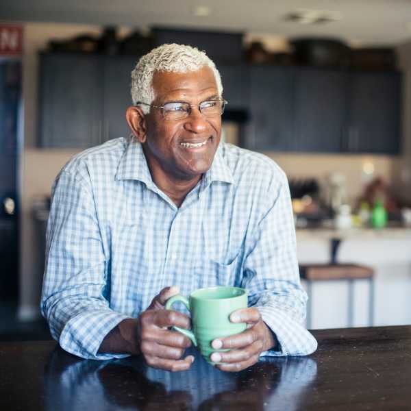 Man with coffee mug at O'Brien Realty Group in Avon, Connecticut