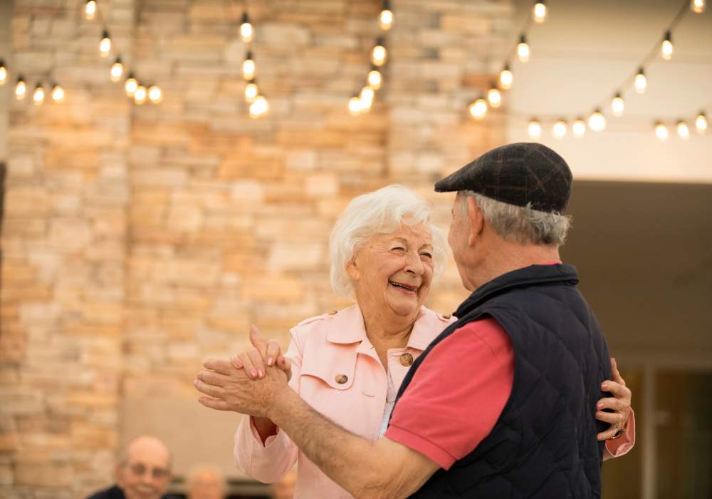 Two residents dancing at Clearwater Living in Newport Beach, California