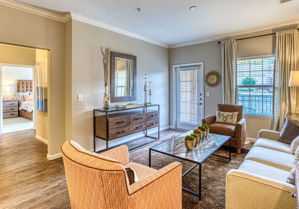 View of bedroom and living room at Arrington Ridge in Round Rock, Texas