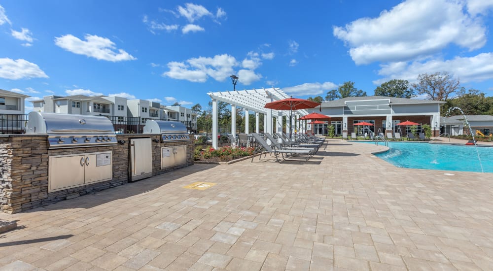 Barbeque area on sundeck near pool at Archer at Brookhill in Charlottesville, Virginia